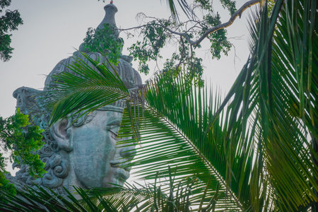 A huge statue of the god Vishnu at the Garuda Wisnu Kencana Cultural Park in Baliの写真素材