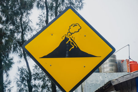 Road sign "Active Volcano" in Indonesiaの写真素材