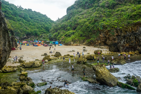 Yogyakarta, Indonesia - January 1, 2019: Campground on a wild beach near the Indian Oceanのeditorial素材