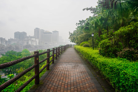 Empty park pedestrian road in China in rainy weatherの写真素材