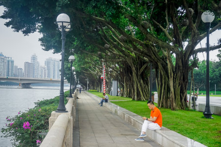Guangzhou, China - May 24, 2019: Weekday in one of the city parksのeditorial素材
