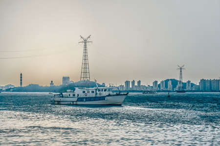 The ship sails along the bay in Xiamen city