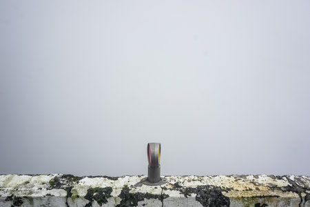 Road reflectors on a barrier on a mountain roadの写真素材