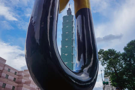 Taipei 101 tower framed by a metal objectの写真素材