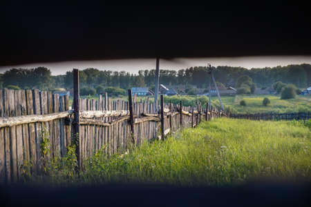 Old fence in a Russian village at sunset. Ufa, Bashkiriaの写真素材