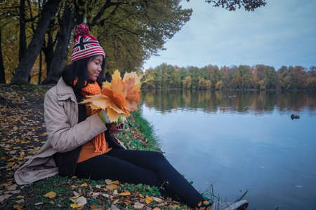 Girl in a beautiful autumn park in St. Petersburg. Russia