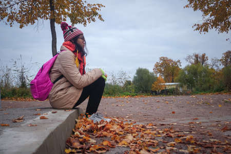 Girl in a beautiful autumn park in St. Petersburg. Russia
