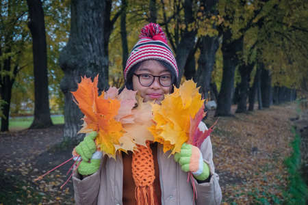 Girl in a beautiful autumn park in St. Petersburg. Russia