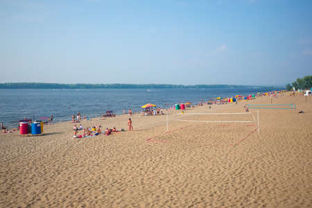 Samara, Russia - July 27, 2019: People rest on the city beachのeditorial素材