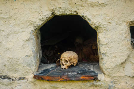 Skull in one of the crypts of Dargavs necropolisの写真素材