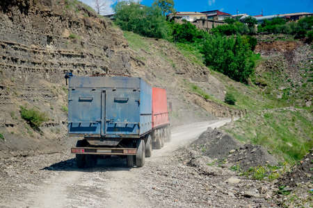 A truck drives along a mountain road in Dagestanの写真素材