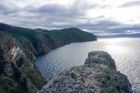 Lonely rock at Cape Khoboy on Olkhon Island at Baikalの写真素材
