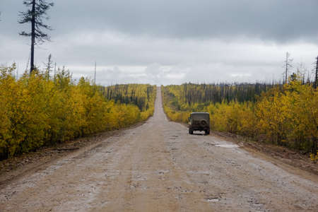 Old gravel road in taiga in Irkutsk region in Russiaの写真素材