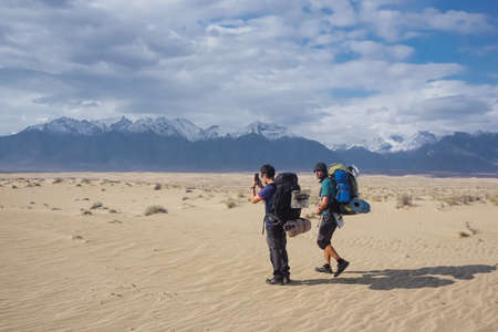 Chara, Trans-Baikal Territory, Russia - September 23, 2020: Travelers in the northernmost desert of...
