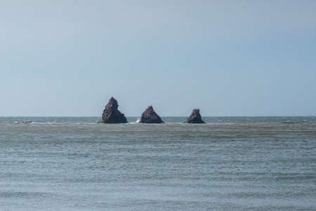 Rocks Three brothers in the sea in Aleksandrovsk-Sakhalinsky in Sakhalin island