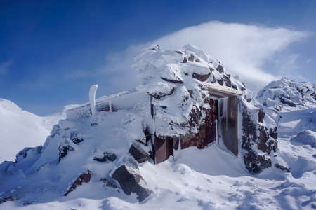 Frozen shelter on the ridge of Avachinsky volcano in Kamchatkaの写真素材