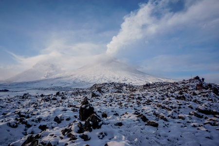 Erupting volcano Klyuchevskaya Sopka in Kamchatka in winterの写真素材