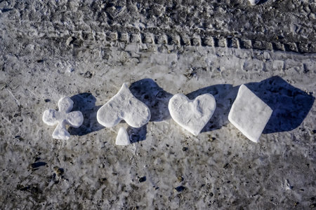 Snow figures of card suits