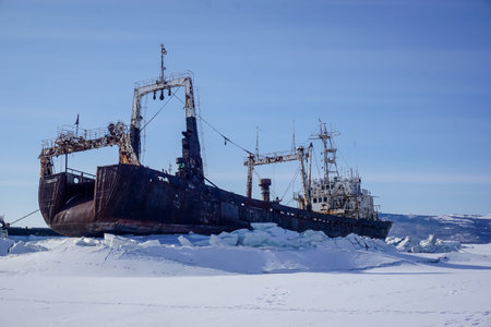 An abandoned ship in a frozen bay