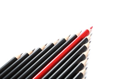 Falling or upping stock market graph, black and red pencils isolated on white background, concept crisis, chart, leadership, uniqueness, independence, initiative, strategy, think different, businessの写真素材