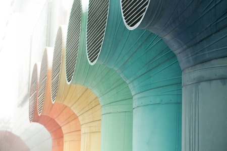 Closeup image of hands holding hair clipper and scissor, isolated on white backgroundの写真素材