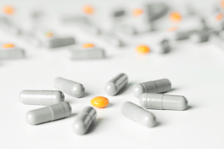 medical pills and capsules pattern on white background. flat lay, top viewの写真素材