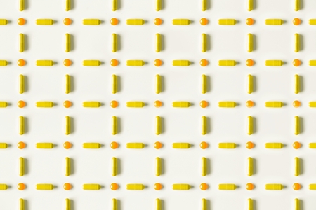 medical pills and capsules pattern on white background. flat lay, top viewの写真素材