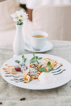 desserts on wood background for restaurant menu, with berries and ice creamの写真素材