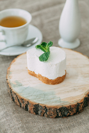 desserts on wood background for restaurant menu, with berries and ice creamの写真素材