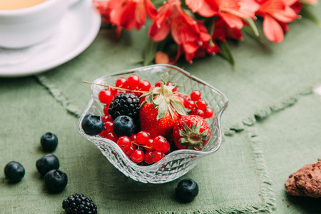 desserts on wood background for restaurant menu, with berries and ice creamの写真素材
