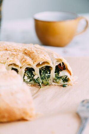homemade pastries with fillings of potatoes, cabbage and fish, in the composition on a textured backgroundの写真素材