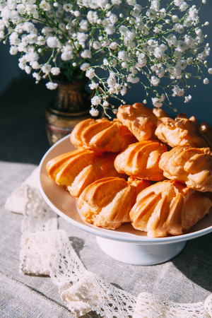 homemade pastries with fillings of potatoes, cabbage and fish, in the composition on a textured backgroundの写真素材