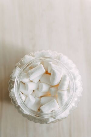 Dessert with coffee on the table. White marshmallow in a glass container in a coffee shop.の写真素材