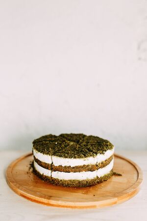 Green natural spinach cake, vegan. Layer cake with spinach and cream. の写真素材