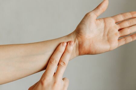 Joint and elbow injuries, fatigue at work. Area of the injury, the image on a clean background. Spasm on the man's wrist.の写真素材