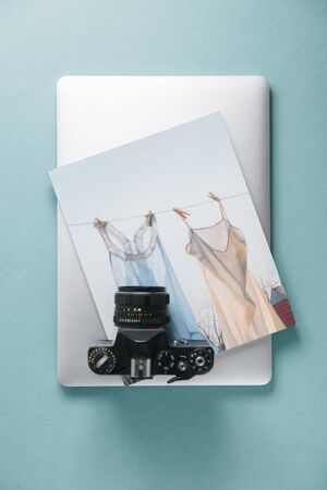  Minimalism in the layout Flatlay. Retro camera on the log with a laptop.の写真素材