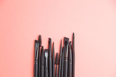 Leather case with makeup brushes. Set of black eyebrow brushes. の写真素材