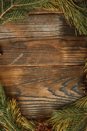 Layout for design for the new year. Christmas wreath on a wooden textured background. の写真素材