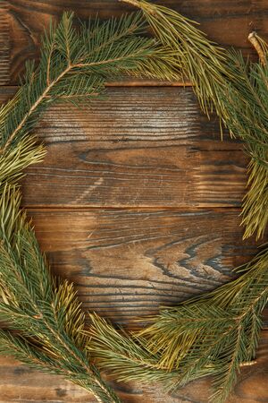 Layout for design for the new year. Christmas wreath on a wooden textured background. の写真素材