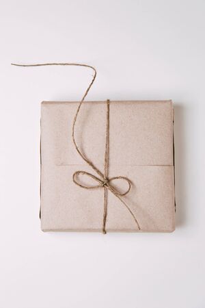 Set of boxes on white background. Gifts in Kraft packaging with ribbon.の写真素材