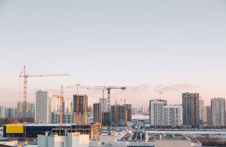  Panorama of construction with cranes in the afternoon. Construction of a modern residential...
