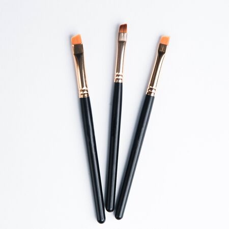 Leather case with makeup brushes. Set of black eyebrow brushes. の写真素材