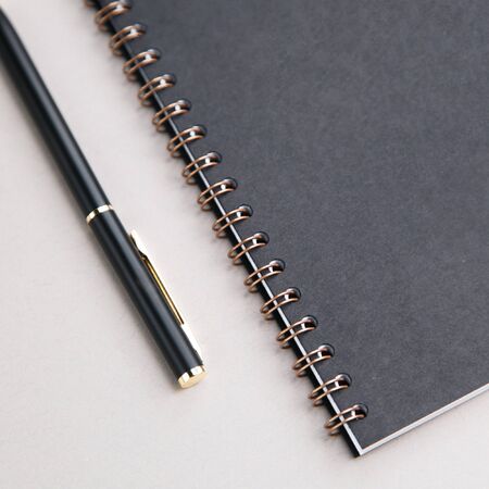  Blank for designers without labels. Notebook and pen on white background.の写真素材