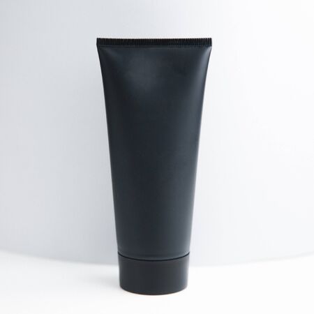 Jar for cosmetics without background. Black matte tube on white background. の写真素材