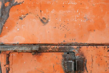 The texture of old rusty metal. Details of the broken mechanism and peeling paint.の写真素材