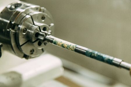 A piece of wood for turning. Workshop with machines.の写真素材
