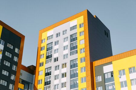 Parts of the facades of modern houses. Bright juicy colors in the construction of buildings.