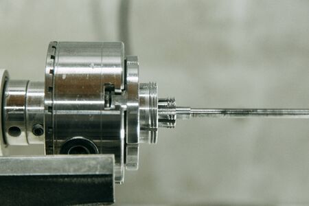 Machine parts in operation, with chips. Shop with machines for wood processing.の写真素材