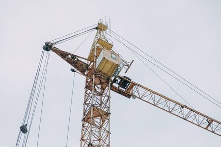 Construction of modern high-rise buildings. Cranes and machinery