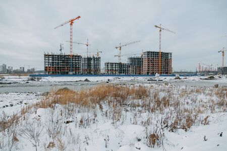 Construction of modern high-rise buildings. Phased construction of structures in winter.の写真素材